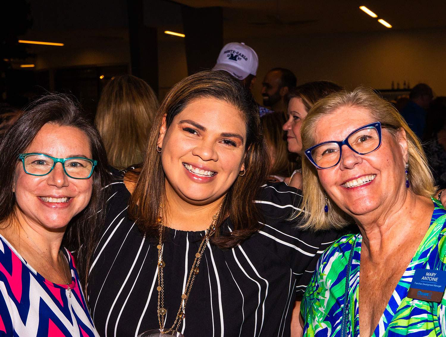 three travel consultants smiling for a picture